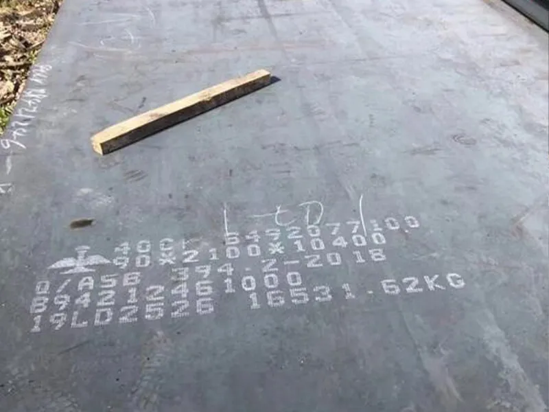 SGS inspector measuring plate thickness at a mill with clipboard and gauge
