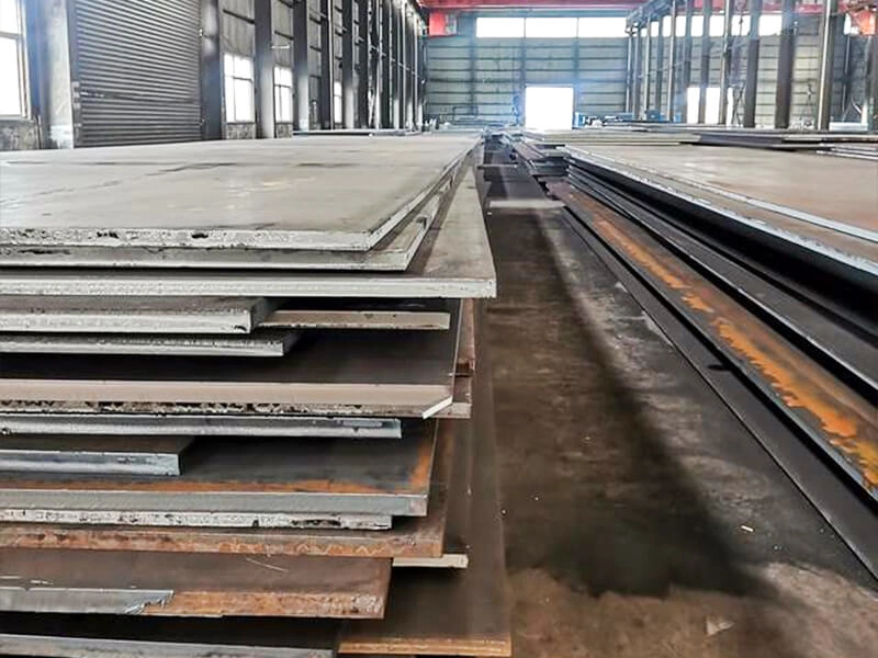 Close-up of a calculator and printed price list with steel grades