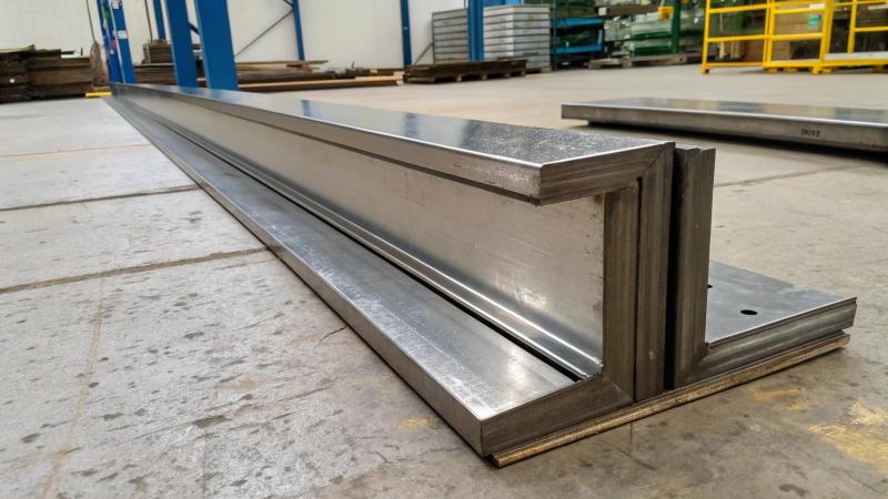 Diagram of a flat bar cross-section with a neutral axis in the center, showing most material is close to the axis