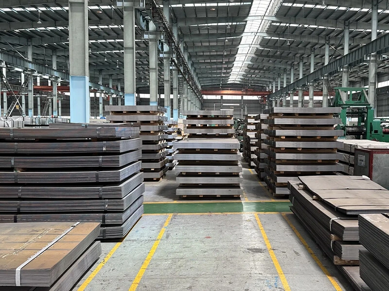 Close-up of a Mill Test Certificate next to steel plates