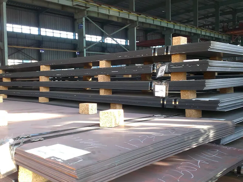 Engineer reviewing steel specifications at a port construction site